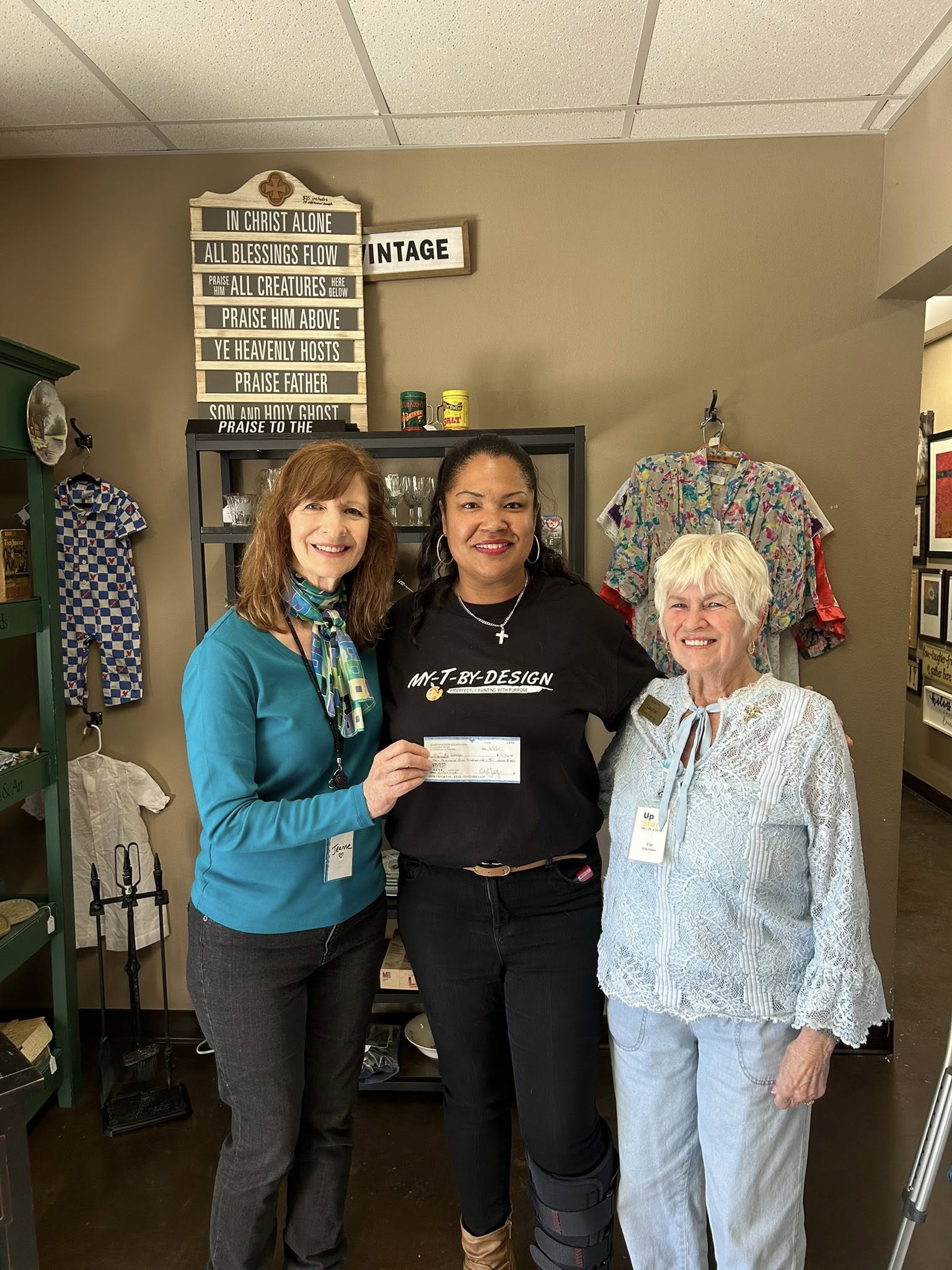 Lakisha Bradley receiving her UpStart grant for My-T-By-Design